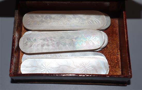 A lacquer box of Mother of Pearl gaming counters